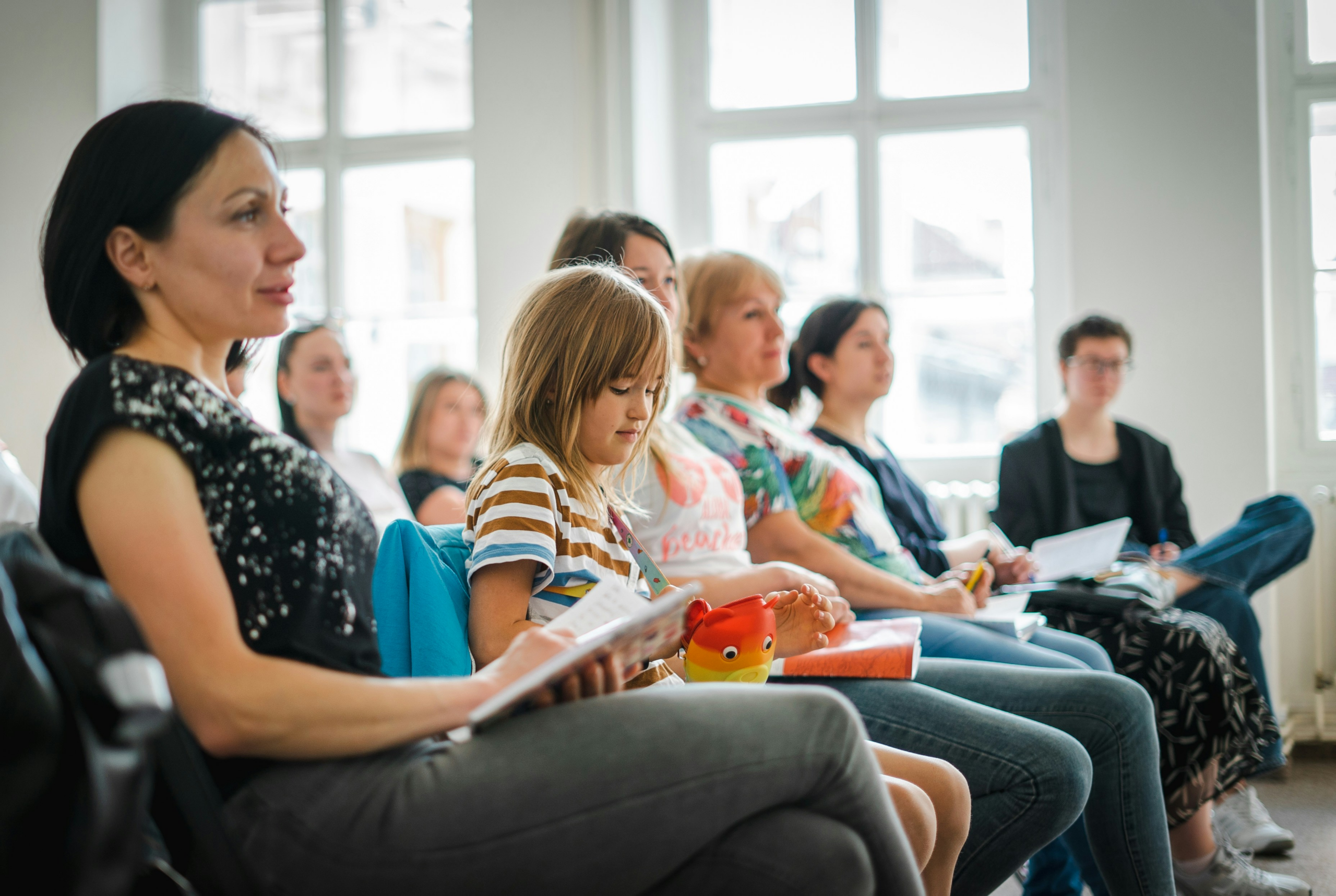 Parents and caregivers seated during a training session