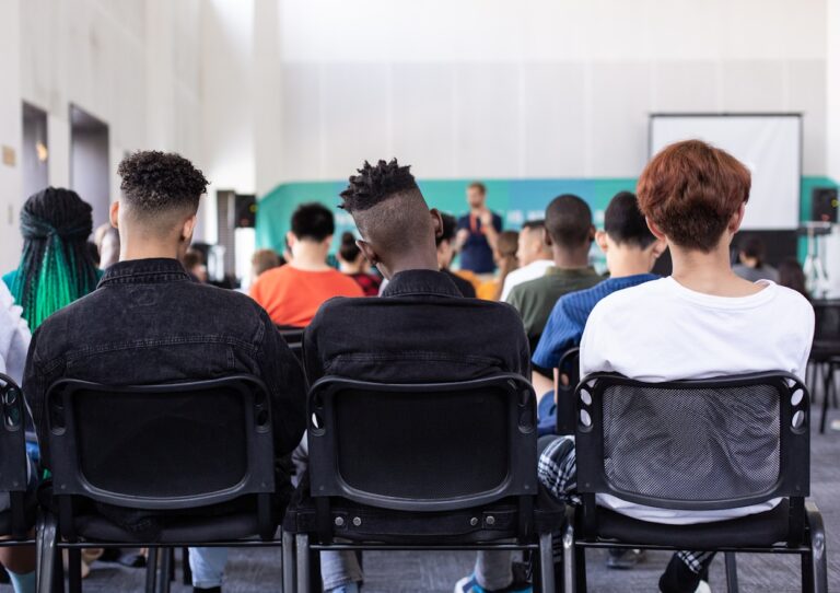 People seated at an epilepsy education presentation