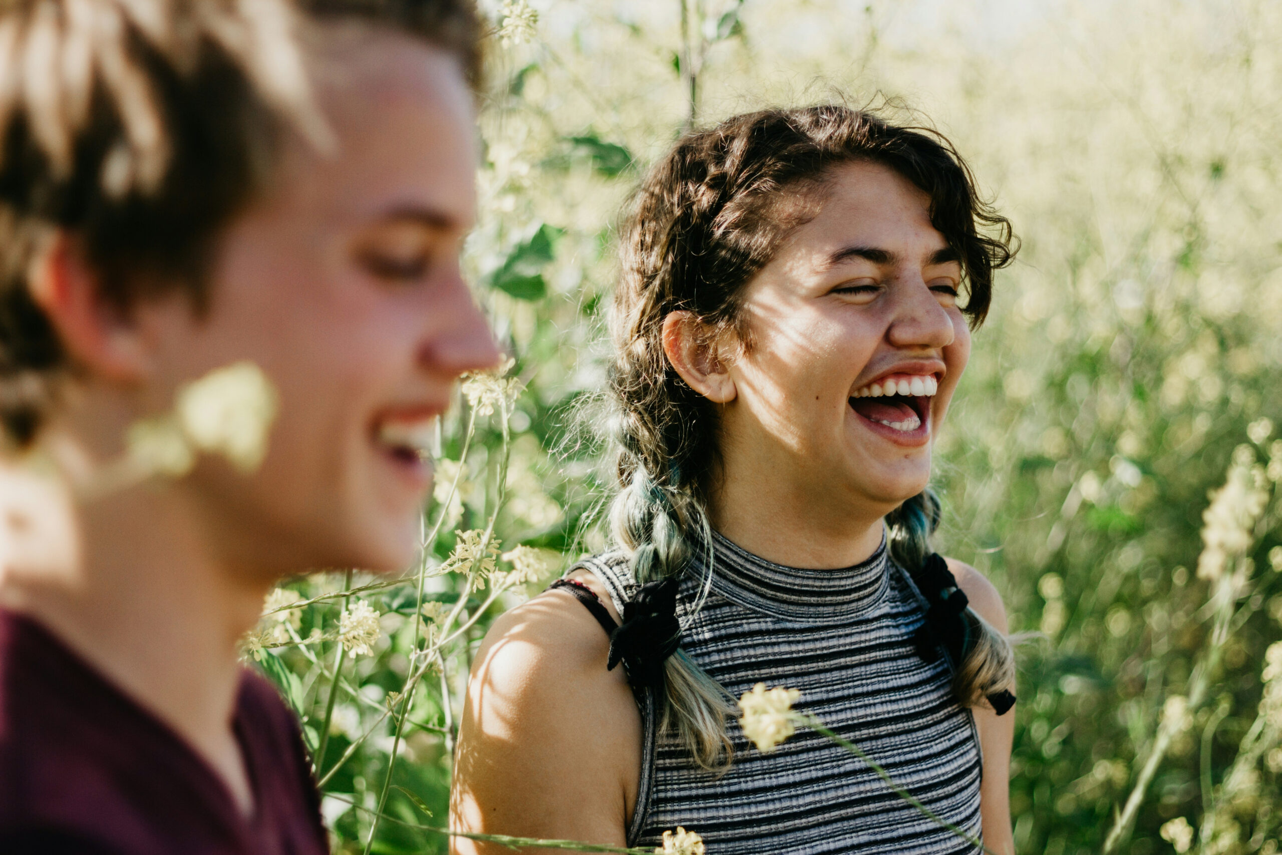 Volunteers smiling outdoors while spending time together