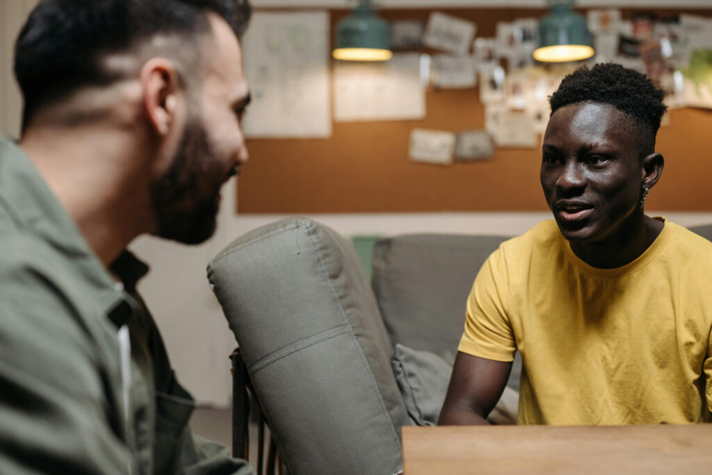 Two people sitting together in a supportive conversation