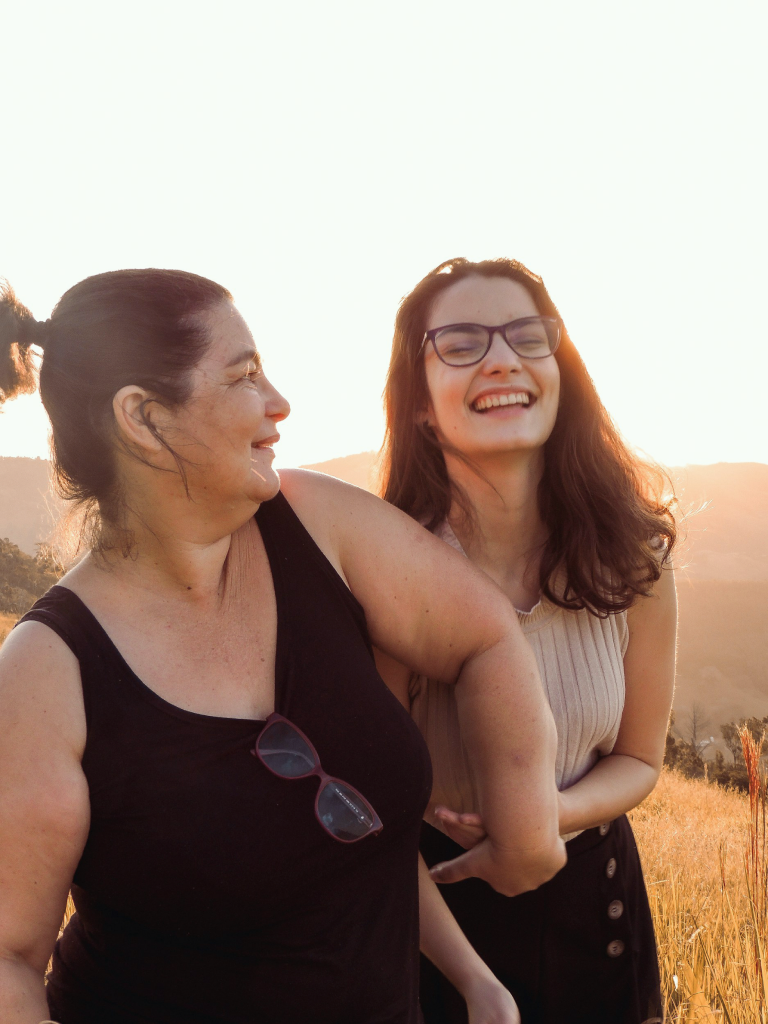 Two people smiling together outdoors